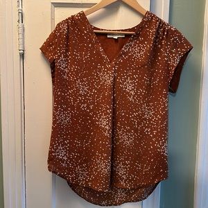 Orange patterned blouse